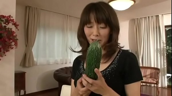 Japanese m. masturbating with a big cucumber